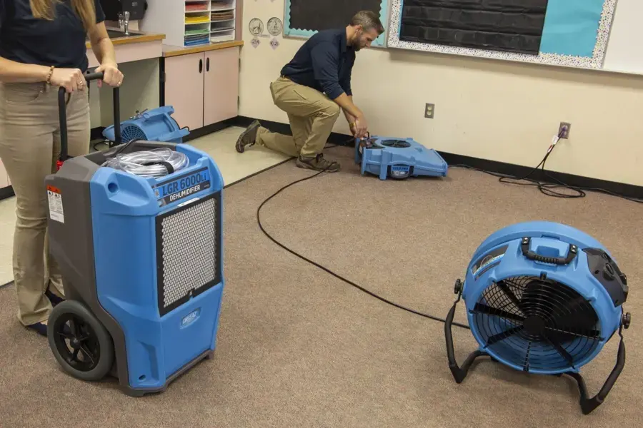 LGR dehumidifier and air movers set up in a carpeted room during a Fontana dry-out