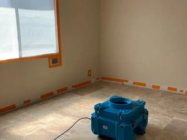 HEPA air scrubber running in a room prepped for drying in Fontana
