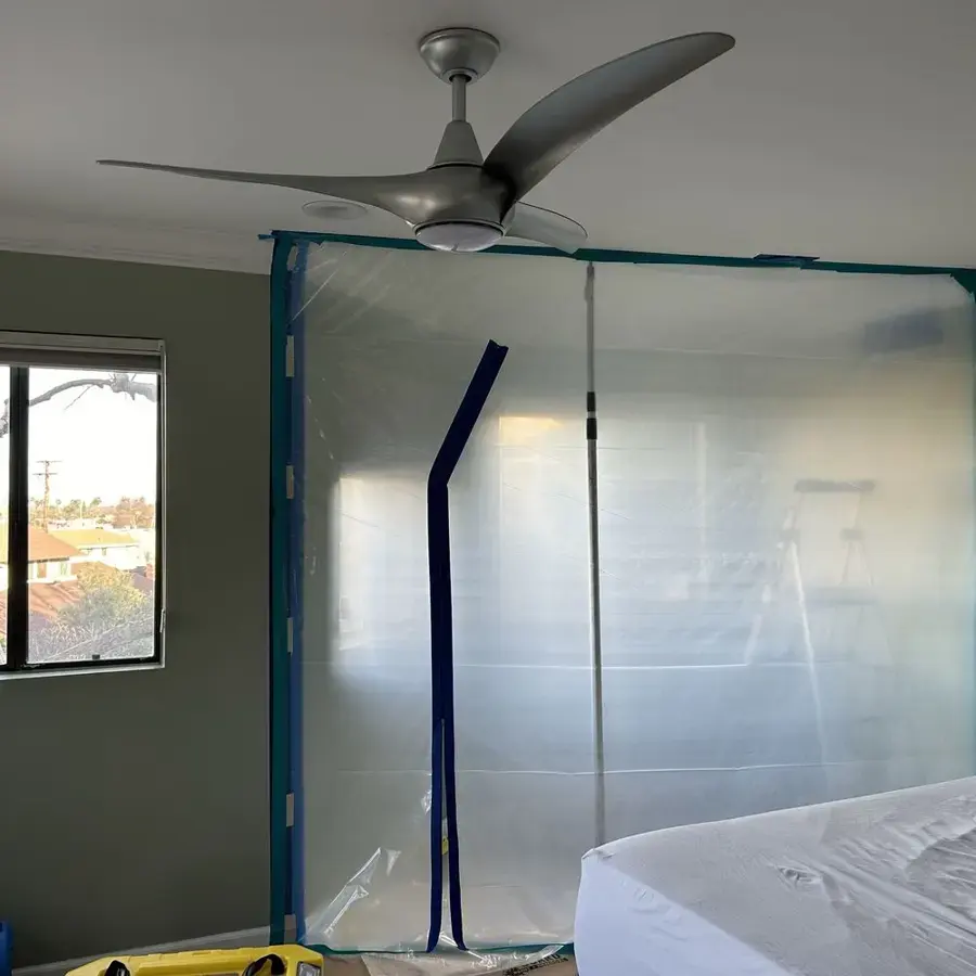 Plastic containment and drying equipment set up in a Fontana bedroom